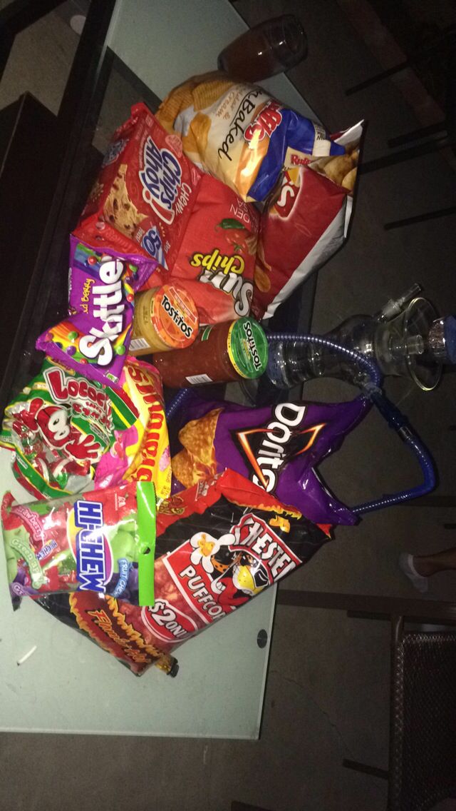 a pile of candy and snacks sitting on top of a counter