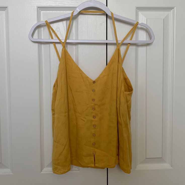 Nwt! Yellow-Gold Strappy Tank Top With Sewn In Design And (Fake) Buttons! Super Cute For The Summer! Yellow Tank Top For Vacation And Spring, Yellow Tank Top For Vacation In Spring, Yellow Tank Top For Spring Vacation, Yellow Cami Top For Vacation, Yellow Cami Top For Summer, Gold Summer Tops For Day Out, Gold Tops For Vacation In Spring, Gold Tops For Summer Day Out, Trendy Yellow Tank Top For Vacation