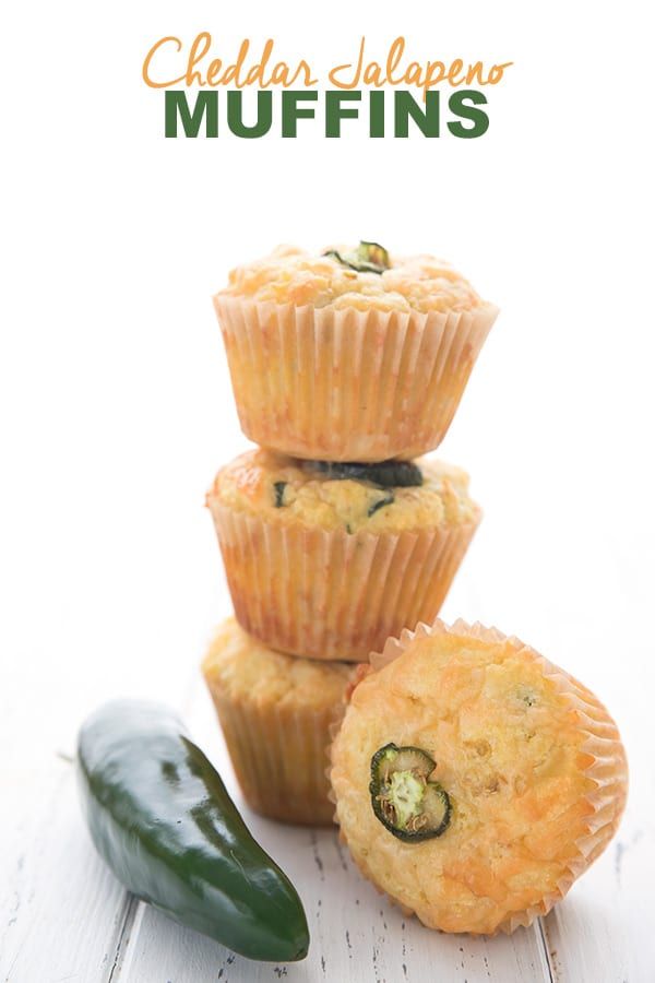 three muffins stacked on top of each other next to a jalapeno pepper