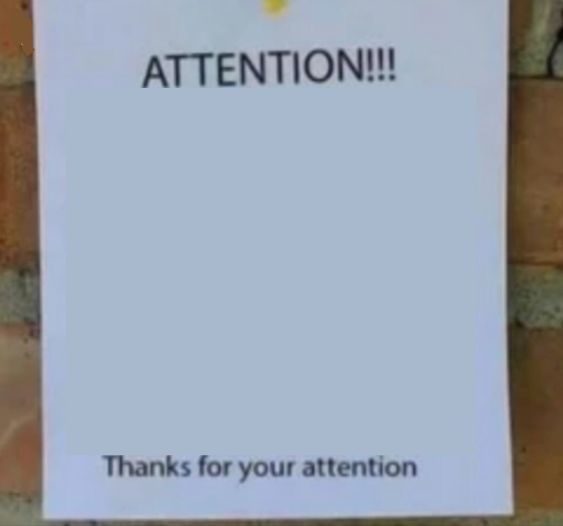 a sign posted on a brick wall that says attention thanks for your attention