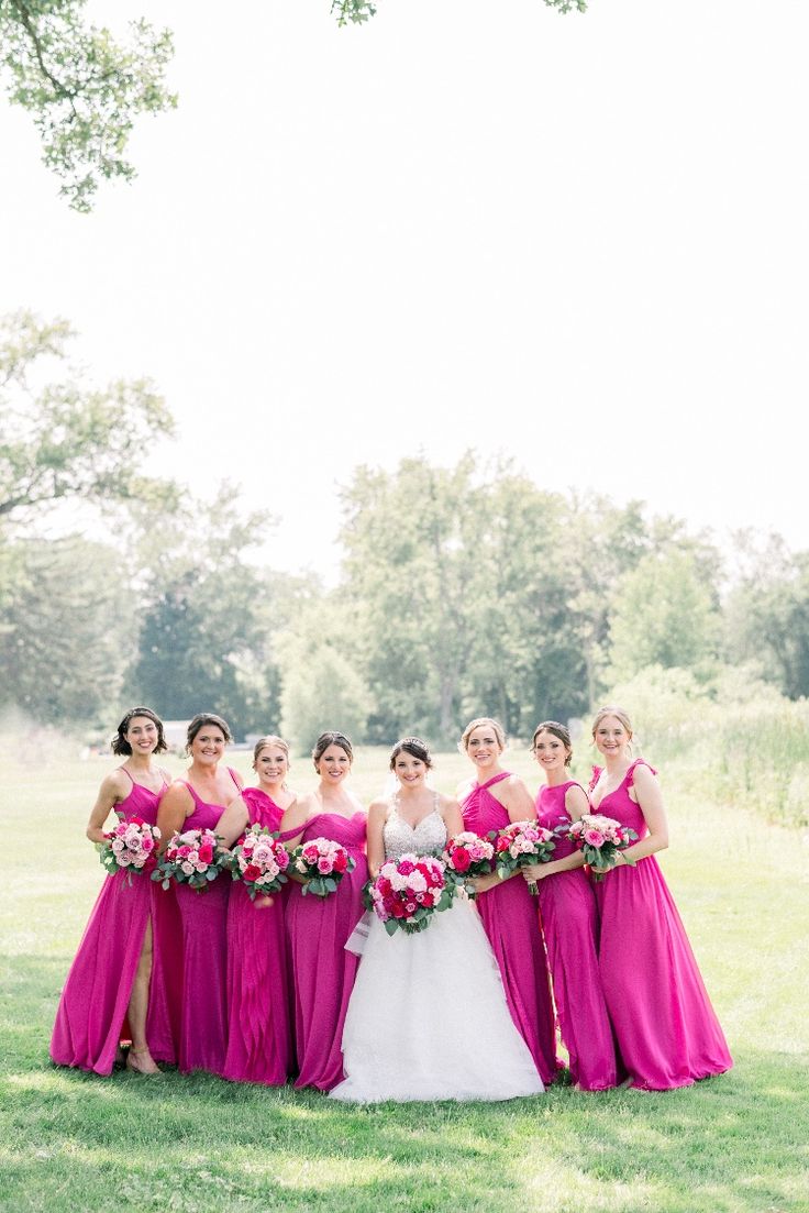 Bride with bridesmaids at hot pink theme wedding Dark Pink Wedding Theme, Dark Green And Pink Wedding, Hot Pink Wedding Theme, Fuscia Wedding, Hot Pink Wedding Colors, Dark Pink Wedding, Pink Wedding Color Palette, Pink Bridal Party, Hot Pink Bridesmaid Dresses