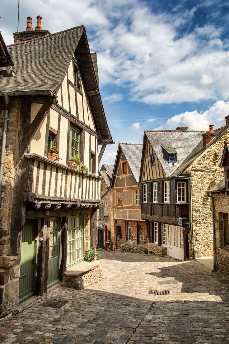 an old european street with cobblestone and stone buildings