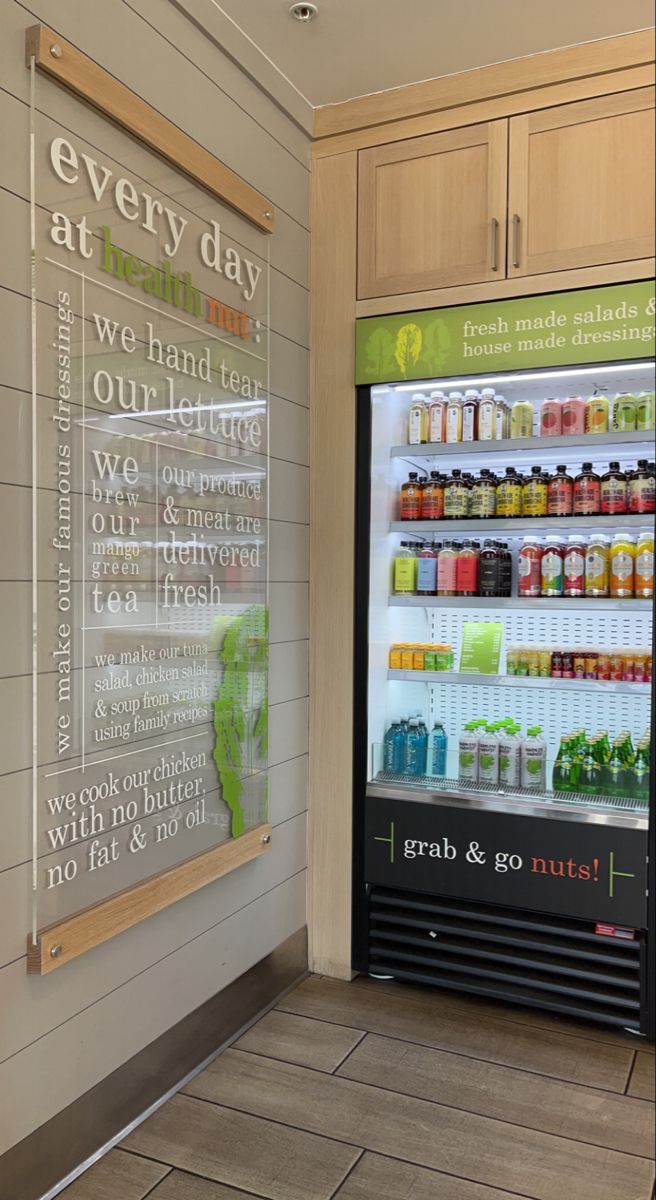 a vending machine in a grocery store next to a sign that says every day