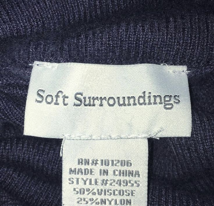 a label on a sweater that says soft surroundings