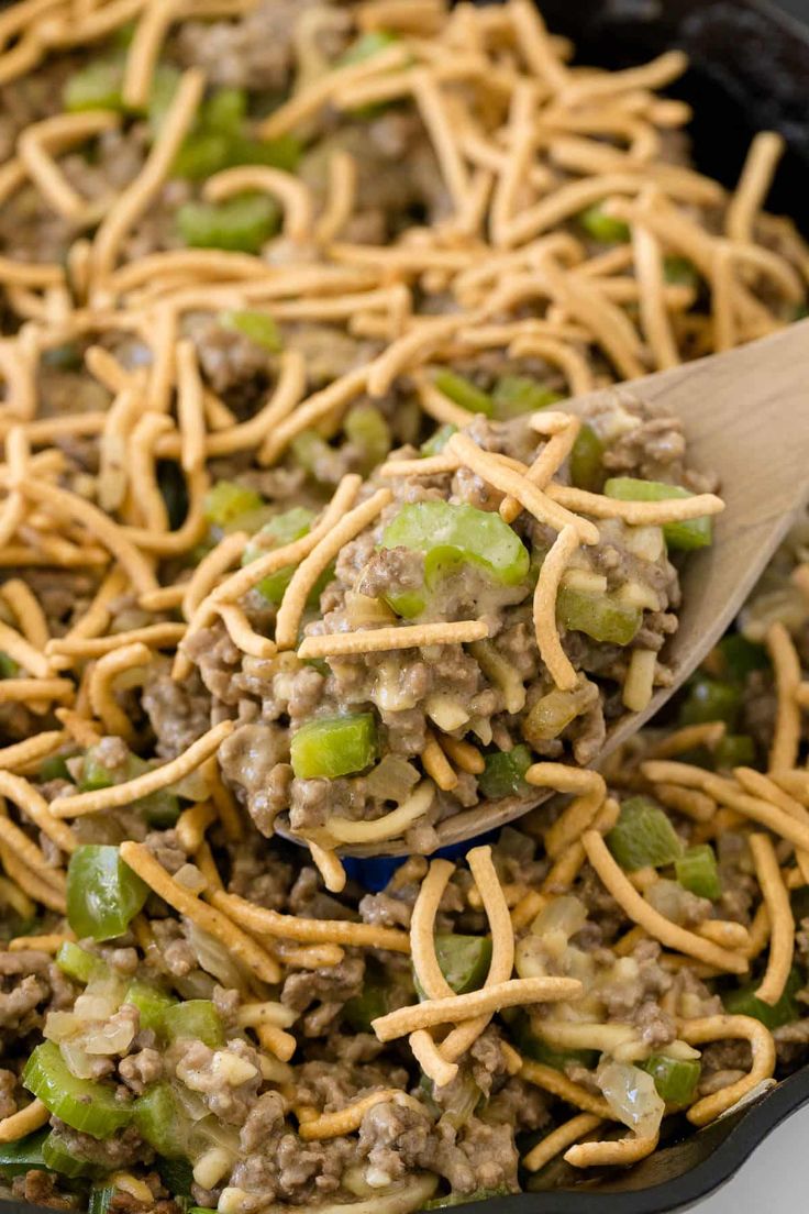 a skillet filled with ground beef and noodles