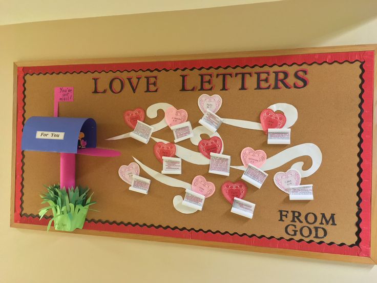 a bulletin board decorated with hearts and mailboxes