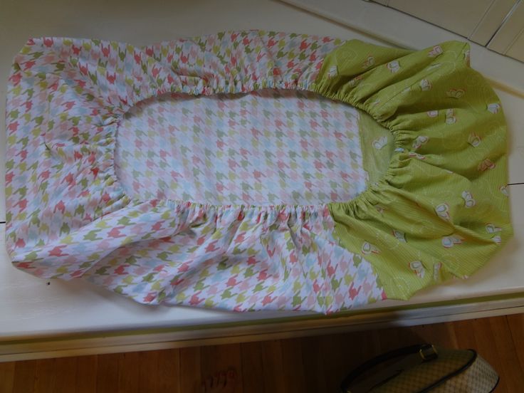 a pair of shoes sitting on top of a counter next to a green and white checkered dress