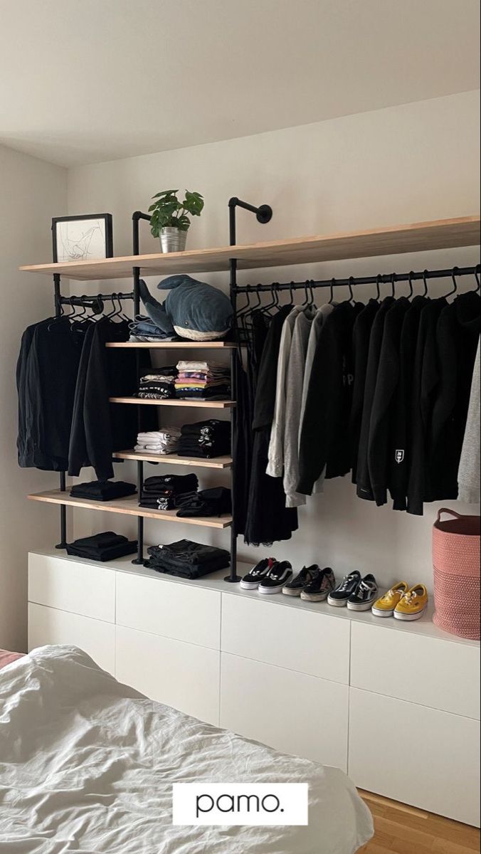 an organized bedroom with clothes and shoes on shelves