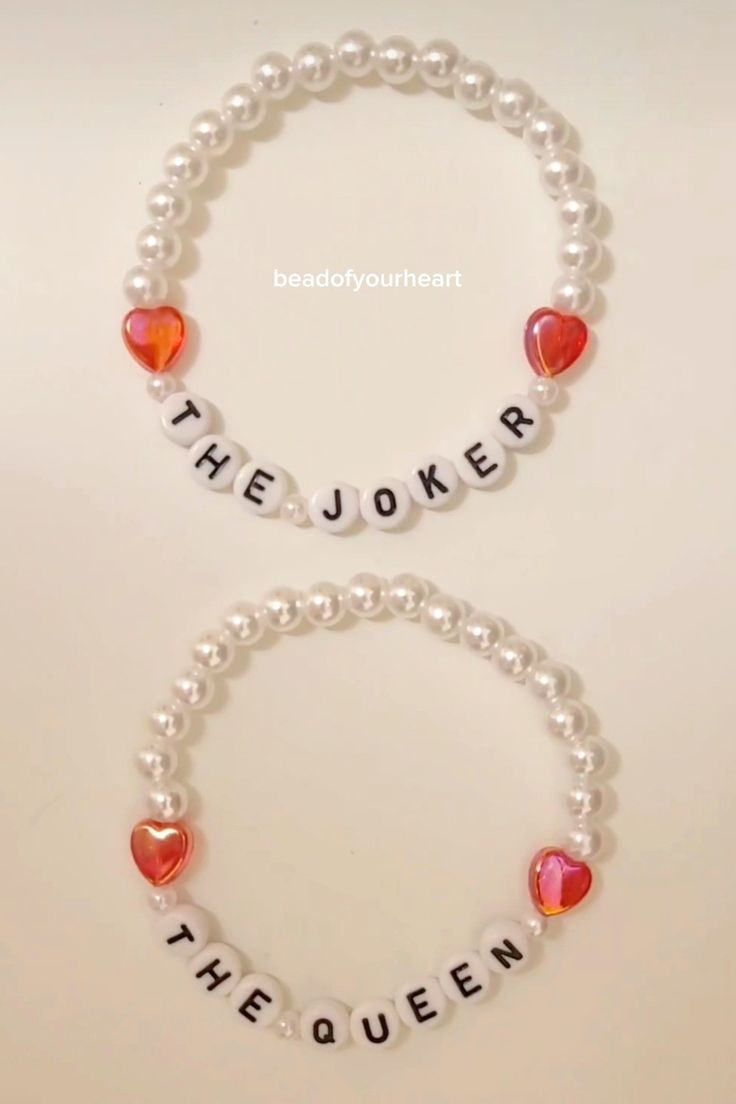 two bracelets that say the joker and the queen with hearts on each bead