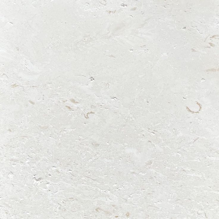 a white marble textured background with small cracks