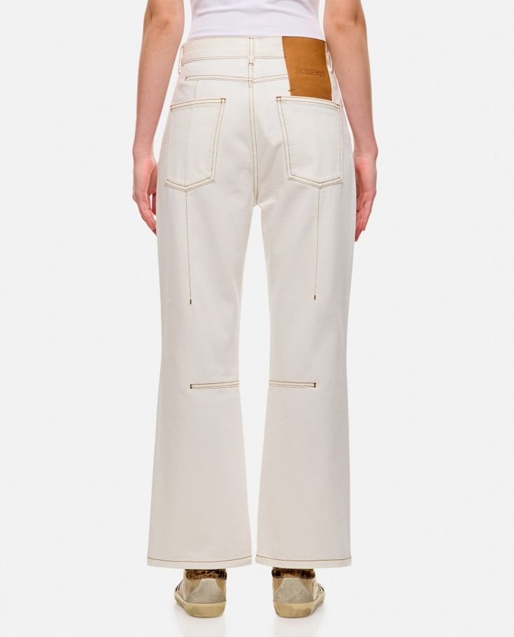 These denim pants by Jacquemus showcase a high waist design that pairs effortlessly with various tops. Featuring five functional pockets, classic belt loops, and contrasting stitching, this piece is a perfect blend of style and practicality.

- Ankle length
- Material: 100% Cotton
- Five functional pockets
- Classic belt loops
- Contrasting stitching Jacquemus Clothing, Jacquemus Jeans, Le Bambino Jacquemus White, Jacquemus White Dress, Jacquemus Linen, Pant Jeans, Classic Belt, Contrasting Stitching, Designer Products