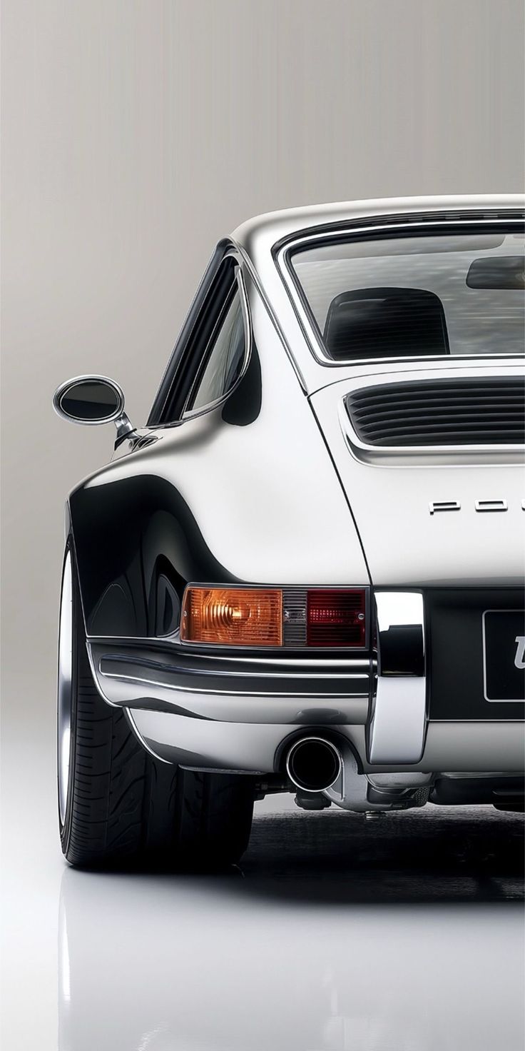 the rear end of a white porsche sports car