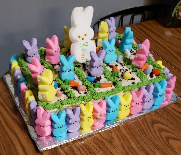 a cake decorated to look like rabbits on a table