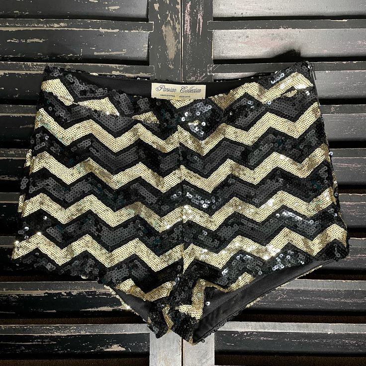 Parisian Collection Women’s Black & Gold Sequined Chevron Mini Shorts Size Small (S) Measures: 13.5” Across Waist | 10” Length | 1.5” Inseam Side Zip Closure Fully Lined New With Tags Fitted Black Shorts For Party, Black Sequin Shorts For Summer, Chic Black Sequined Shorts, Black High-waisted Shorts For Party, Black Short Bottoms For Party, Black Sequined Short Bottoms, Trendy Black Sequined Bottoms, Chic Party Season Shorts For Night Out, Chic Shorts For Night Out Party Season