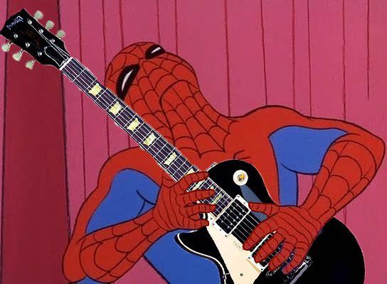 a spiderman playing an electric guitar in front of a pink wall