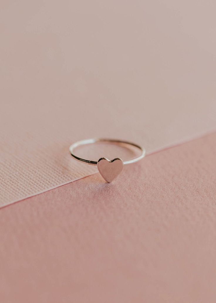 A tiny heart soldered onto our daintiest band, making it a perfect ring to add to any stack. 🤟🏼 Heart-shaped pendant is attached to 1mm wide band. Available in 14kt Gold Fill + Sterling Silver. Handmade in Eau Claire, WI. Our jewelry is handmade so each piece will be unique and may vary slightly from what is pictured. Everyday Wear Jewelry, Backdrops Necklace, Zodiac Rings, Dainty Band, Hoop Charms, Tiny Heart, Be Mine, Jewelry Case, Wide Bands