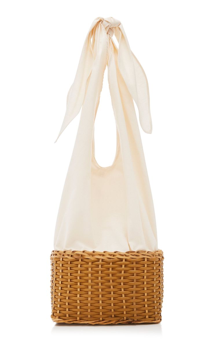 Amora tote is made from woven raffia with a durable canvas lining. Tie the tops together to create handles or fold down to create a lined basket Chic Woven Beach Bag With Round Handle, Woven Straw Top Handle Bag For Shopping, Cream Shoulder Bag With Bamboo Handle, Natural Shoulder Bag With Bamboo Handle For Shopping, Chic Straw Bag For Market, White Tote Shoulder Bag With Bamboo Handle, Straw Bucket Bag For Market, Woven Top Handle Beach Bag, Woven Top Handle Beach Bag For Shopping