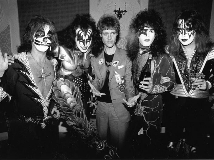 the kiss band posing for a black and white photo in their dressing room with clown makeup