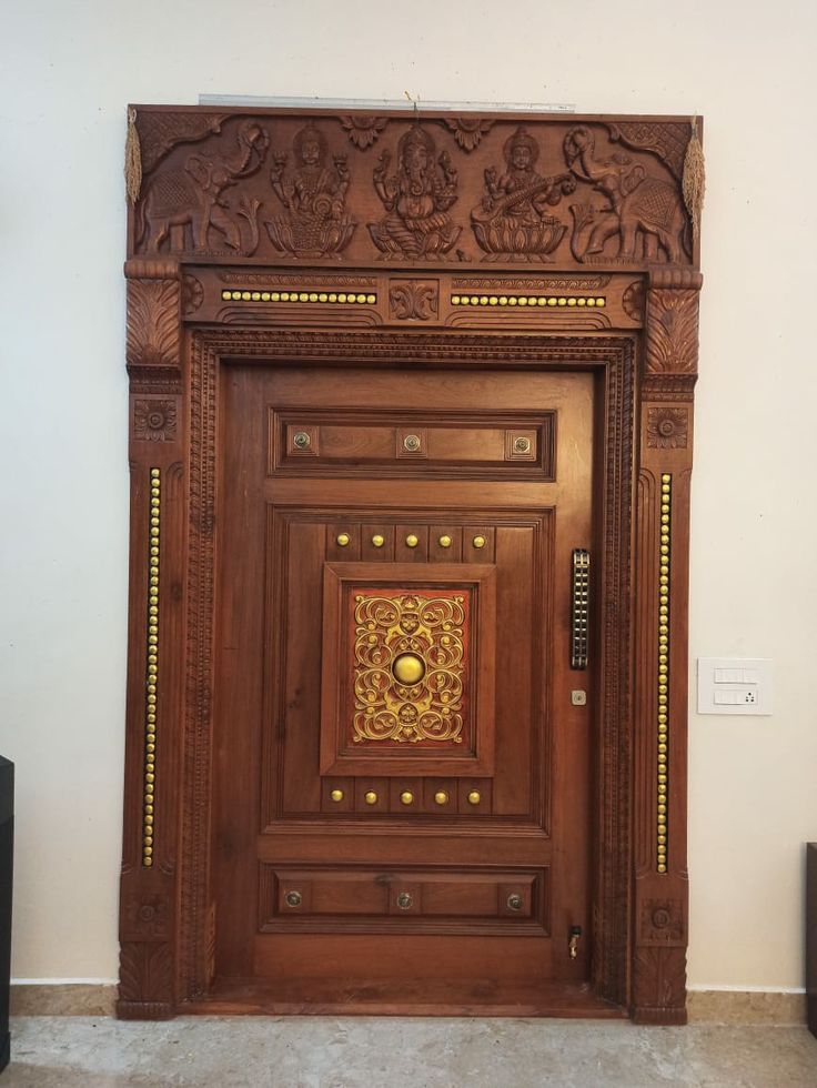 a wooden door with intricate carvings on it