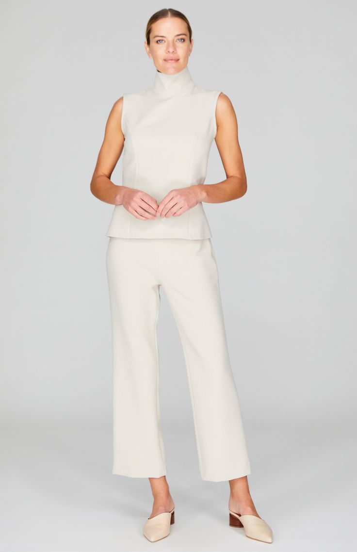 A classic straight leg pant with all the right details. Cut in a comfortable and luxurious Italian double face fabric, this ankle length pant has a beautiful drape and weight and is finished with a simple back zip to maintain a clean front. NOTE: This pant runs generously and most people have sized down from their typical Mi Jong Lee pant size. Chic Formal Pants With Seam Detailing, Elegant Formal Pants With Seam Detailing, Elegant Solid Color Dress Pants With Straight Hem, Chic Fitted Wide Leg Pants With Straight Hem, Chic Straight Hem Pantsuit For Work, Elegant Straight Hem Dress Pants, Elegant Wide Leg Pants For Workwear With Straight Hem, Chic Pantsuit With Straight Hem For Workwear, Elegant Solid Color Ankle-length Pantsuit