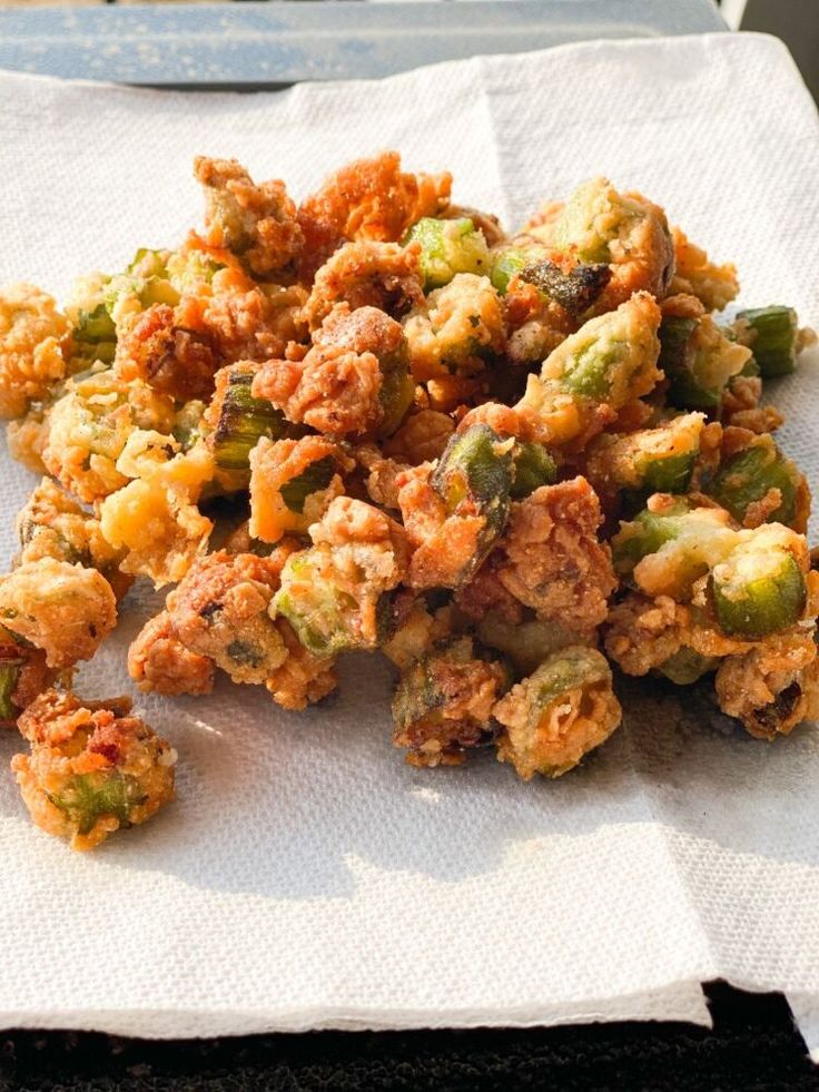 a pile of fried food sitting on top of a white napkin