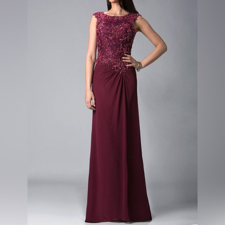 Feriani 18402 Evening Dress Is A Masterpiece Of Elegance And Sophistication. This Luxurious Gown Features A Fitted Silhouette With A Dazzling Embroidered Bodice, Adorned With Intricate Beading And Delicate Lace Appliqus. The Dress Boasts A Classy Bateau Neckline And Feminine Cap Sleeves, Enhancing Its Timeless Charm. The Floor-Length Skirt Is Designed To Drape Gracefully, Providing A Flattering And Unforgettable Silhouette, Perfect For Any Formal Occasion. Dress Was Store Sample Elegant Red Mother Of The Bride Dress For Banquet, Elegant Red Embellished Evening Dress, Embellished Burgundy Wedding Dress, Elegant Red Embellished Gown, Elegant Embellished Burgundy Dresses, Burgundy Evening Dress With Sweep Train, Elegant Burgundy Evening Maxi Dress, Elegant Burgundy Dress For Banquet, Elegant Burgundy Wedding Gown