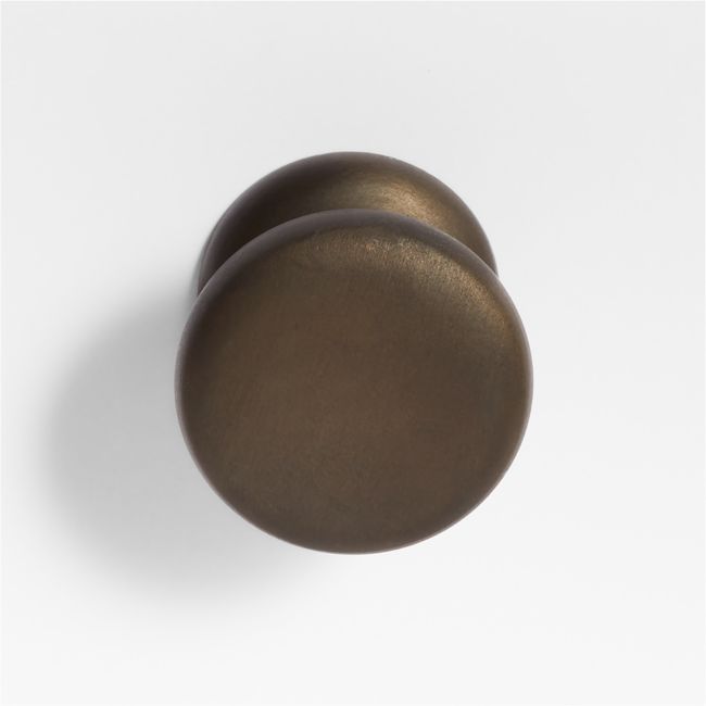 two round knobs on a white surface