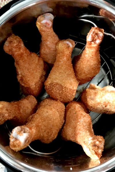 fried chicken sticks in an air fryer basket