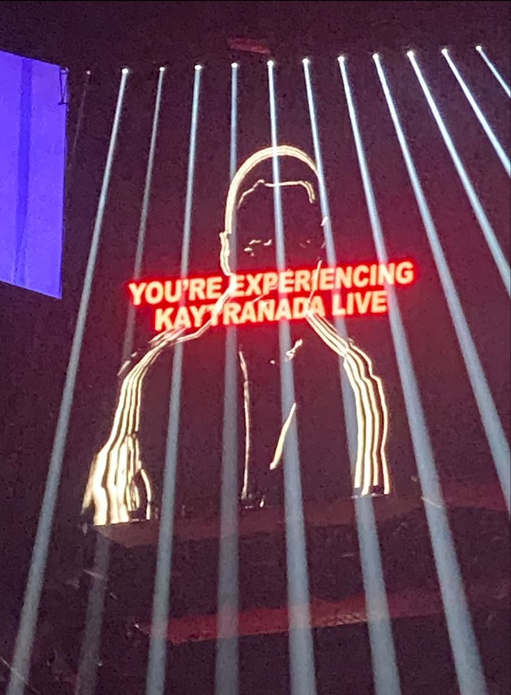 a neon sign that says you're experiencing maynana live