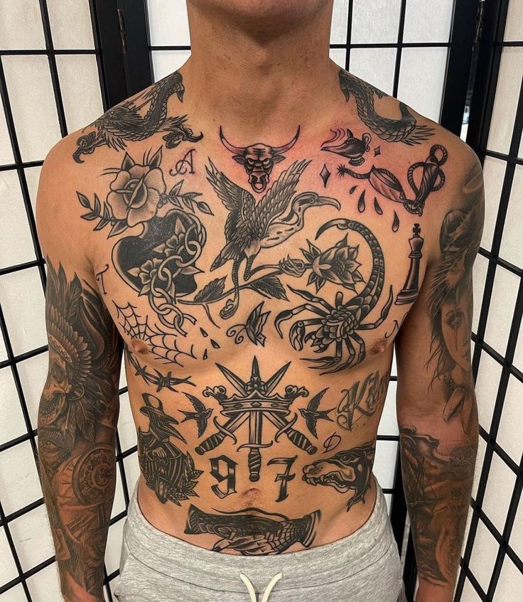 a man with lots of tattoos on his chest