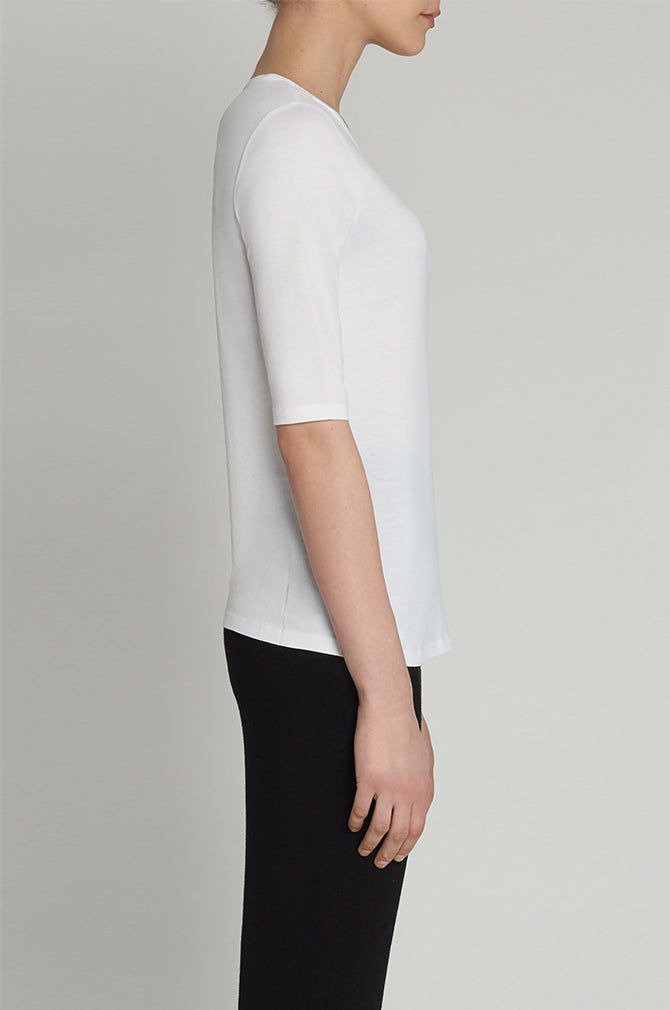 Our favorite elbow sleeve t-shirt. Perfect for layering or worn on its own. TTETR88 - 100% Cotton - Sleeve hits just above elbow - Model is 5'10" wearing a size S White Fitted Crew Neck Top, Fitted Cotton White Tops, White Classic Fitted Top, Classic White Fitted Top, Classic Fitted Crew Neck T-shirt, Classic Crew Neck Stretch Tops, Classic Stretch Crew Neck Tops, White Stretch Basic Short Sleeve Top, White Relaxed Fit Top With Half Sleeves