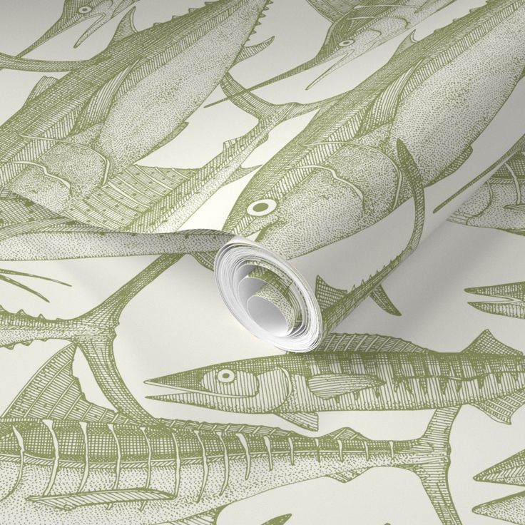 a wallpaper with green and white fish on it's side, next to a roll of tape