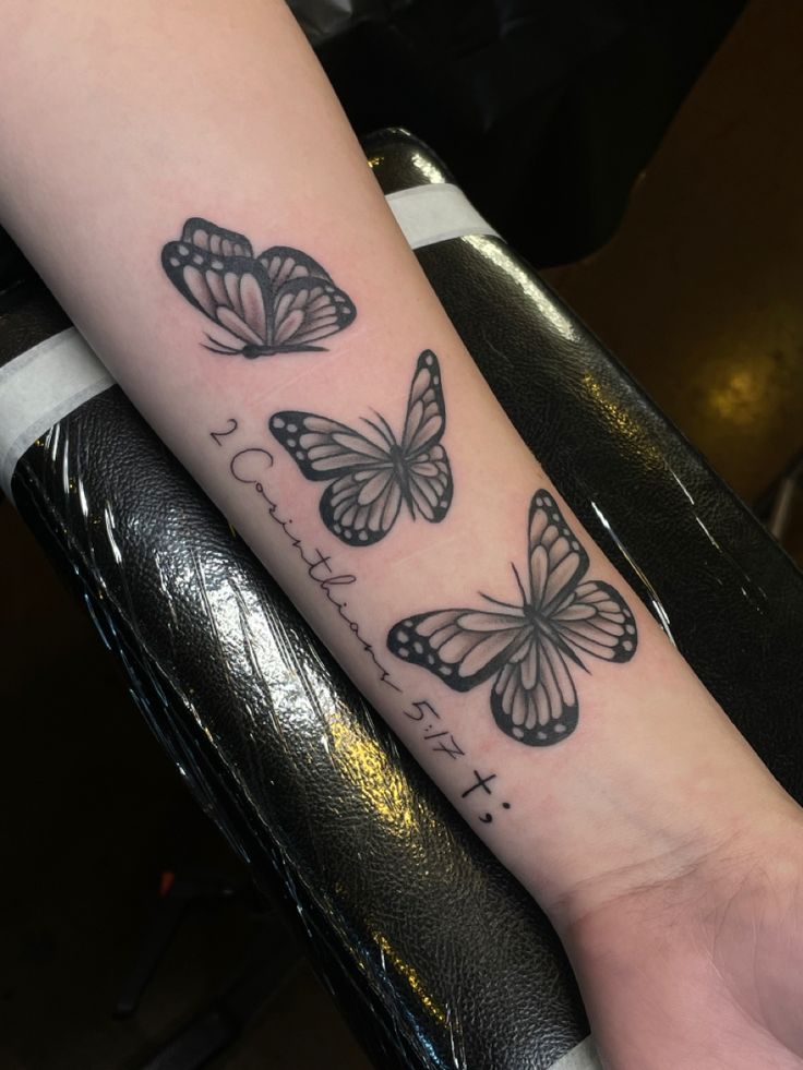 a couple of butterflies on the arm