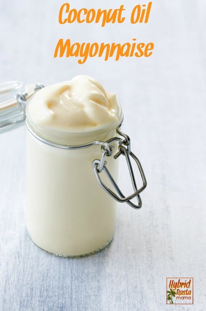 a glass jar filled with cream sitting on top of a table