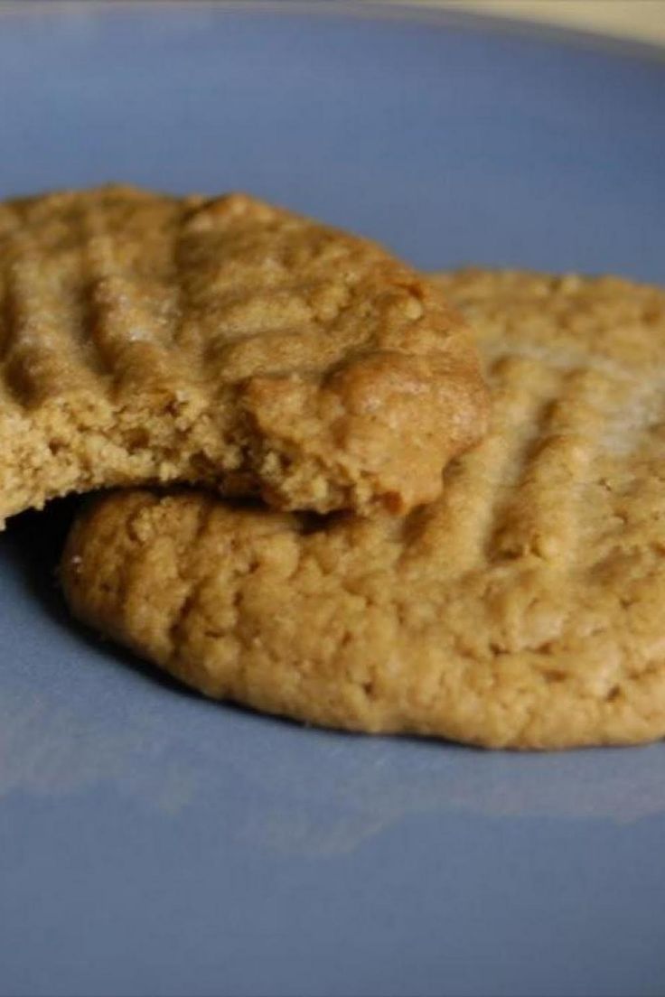 two peanut butter cookies on a blue plate