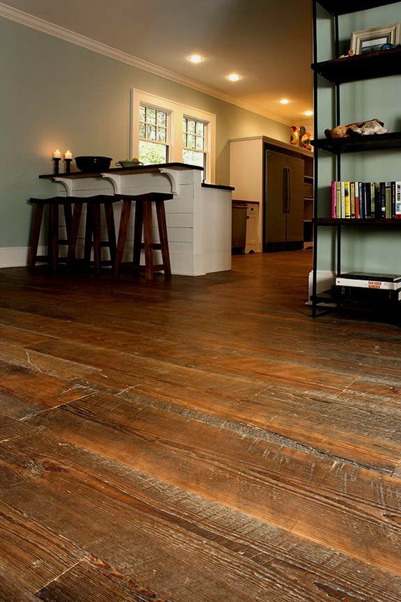 a living room filled with furniture and wooden floors