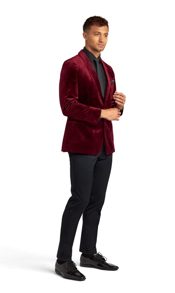 A slim burgundy velvet tuxedo coat with one button and a shawl lapel. Elegant Burgundy Outerwear For Party, Elegant Burgundy Party Outerwear, Red Velvet Suit Mens, Velvet Tuxedo Style Evening Outerwear, Velvet Tuxedo Blazer With Suit Collar, Tailored Velvet Tuxedo Outerwear, Velvet Tuxedo For Winter Party, Luxury Burgundy Blazer For Formal Occasions, Velvet Tuxedo Style Blazer For Semi-formal Events