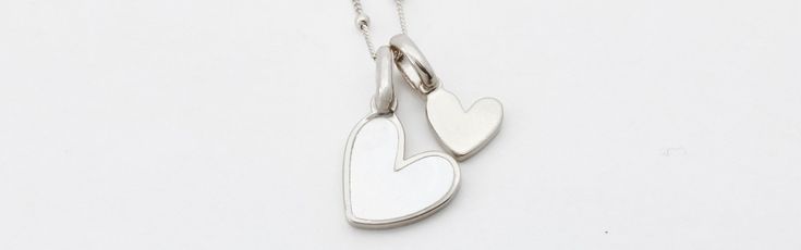 The small heart charm is engravable to showcase your favorite friends and loved ones. You have a heart of gold and now you’ve found the perfect pair. 
See here for additional heart charms. Heart Charms For Anniversary, White Gold Charms For Valentine's Day, Valentine's Day Double Heart Charms, Valentine's Day White Gold Charms, Heart-shaped Charm Necklaces With Removable Charms, White Heart Pendant Charm Necklace With Heart Beads, White Heart Beads Charm Necklace With Heart Pendant, Everyday White Sterling Silver Heart Necklace, Silver Heart Necklace With Removable Charms