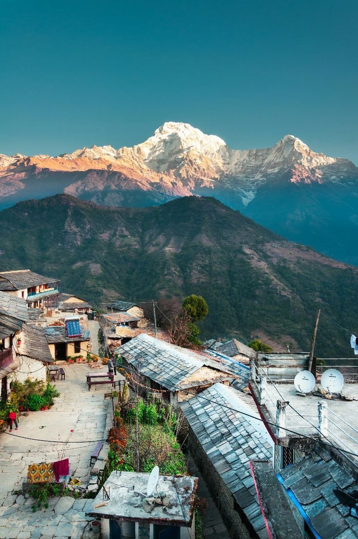 a village with mountains in the background