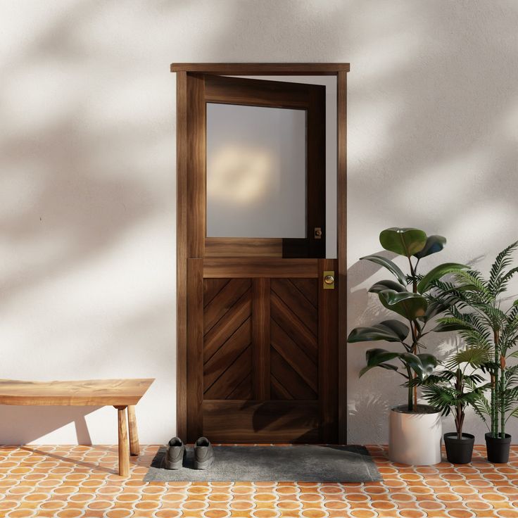 a wooden door sitting on top of a tiled floor next to a bench and potted plant