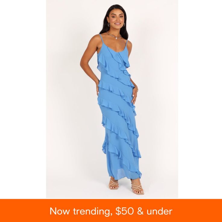 a woman in a blue dress with the words now trending, $ 50 & under