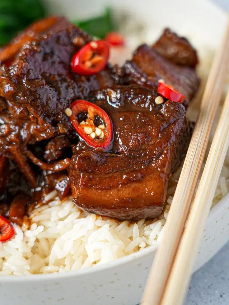 beef and rice with chopsticks in a bowl