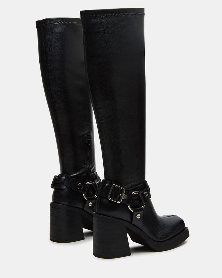 The ONYX is a sleek moto -inspired boot, featuring a bold block heel and reaching to the knee. Elevate your style with these statement boots that provide both fashion and function—expertly crafted for comfort and durability.  3.25 inch heel height Size 6 measurements: 13.5 inch shaft circumference, 16.5 inch shaft height  Size 8 measurements: 14.25 inch shaft circumference, 17.25 inch shaft height Size 10 measurements: 15 inch shaft circumference, 18 inch shaft height  Vegan leather upper material with hardware Textile lining Vegan leather sock Synthetic sole Imported Edgy Black Fitted Knee-high Boots, Long Black Boots Outfit, Fitted Black Knee-high Boots For Streetwear, Edgy Black Platform Knee-high Boots, Tall Chelsea Boots, Leather Knee-high Platform Moto Boots, Black Boot Heels, Best Fall Shoes, Black Knee-high Platform Moto Boots