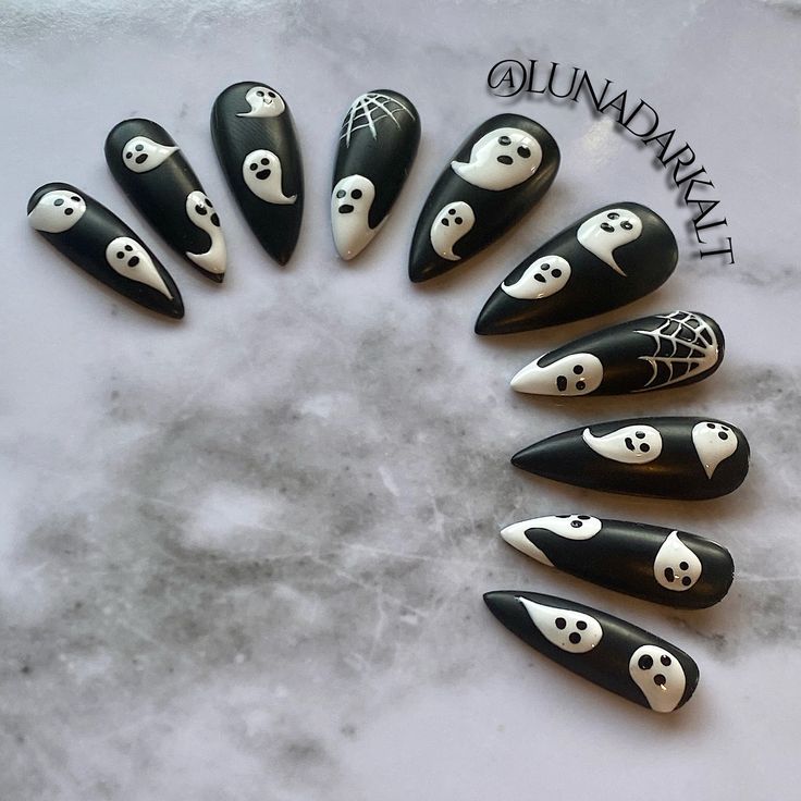 Welcome to LD Nails! 🖤 One set of 10 REUSABLE Press On Nails 🖤 🖤 Made to order in your shape & size 🖤 👻 The BOO: matte black Halloween ghost press on nails with glossy white ghosts and webs! Purchase INCLUDES an application kit! It consists of: 🖤 detailed application & removal instructions 🖤 a sealed and sanitary mani kit (100/180 file, buffer block, cuticle pusher) 🖤 2 alcohol pads 🖤 nail tabs or glue (glue is standard, request tabs in the personalization box if you prefer them!) *Only one kit is sent per order. Extra kits and kit contents can be picked up here 👉 https://www.etsy.com/ca/listing/817160463/application-kit-press-on-nails-gothic Est. 2020: LD Nails specializes in custom Gothic, Witchy and Alternative Press On Nails. I draw inspiration from what I love, so you’ll fin Black And White Halloween Nails, Halloween Ghost Nails, Ghost Nails, Nails Goth, Cartoon Nails, Spooky Nails, Halloween Press On Nails, Goth Nails, Spooky Ghost