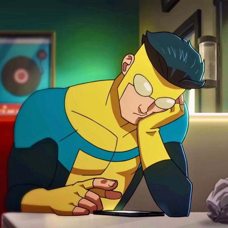 a cartoon character sitting at a table with his head in his hands and looking down