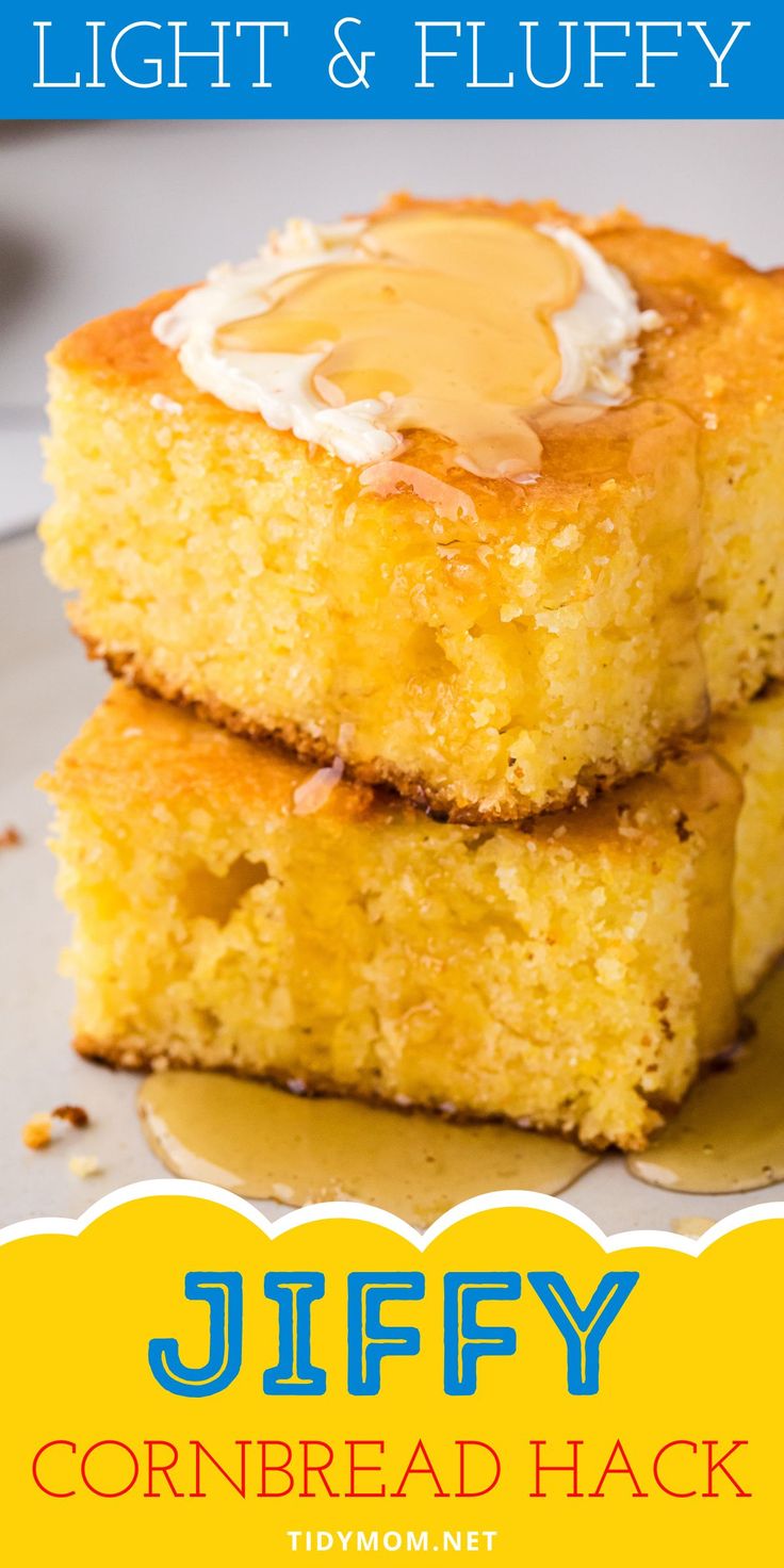 two pieces of cornbread are stacked on top of each other and topped with an egg