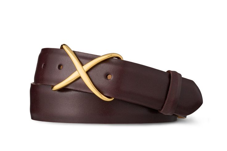 Distinctive and classic, the gold "X" buckle on this versatile belt will accentuate any outfit. The beauty of glazed calf leather is almost unmatched in its timelessness and versatility. You'll wear this one forever. 1-3/8" wide Classic "X" buckle Made in America Luxury Gold Leather Belt Buckle, Luxury Cognac Belt Buckles, Luxury Classic Cognac Belt Buckles, Luxury Gold Adjustable Belt Buckles, Luxury Modern Belt Buckles With Gold Buckle, Classic Luxury Cognac Belt Buckles, Luxury Brass Buckle Belt For Business, Alligator Belt, American Alligator