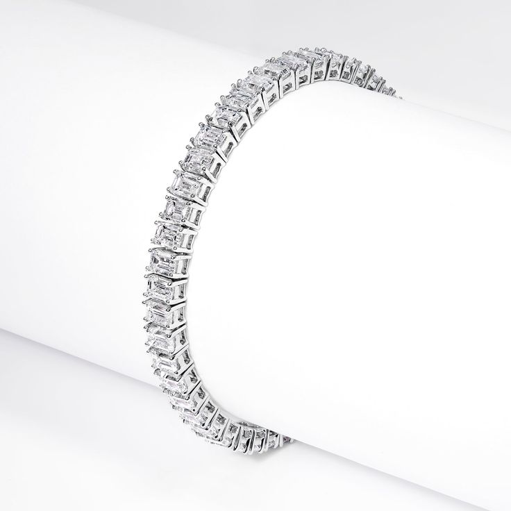 The LING 15.86 Carat Lab-Grown Diamond Tennis Bracelet features EMERALD CUT DIAMONDS brilliants weighing a total of approximately 15.86 carats, set in 14K White Gold.Style:DiamondsDiamond Size: 15.86 CaratsDiamond Shape: Emerald CutSettingMetal: 14 Karat White GoldMetal Weight: 16.00 GramsTotal Carat Weight: 15.86 CaratsClasp: Box catch with hidden safety Diamond Tennis Bracelet, Tennis Bracelet Diamond, Emerald Cut Diamonds, Diamond Sizes, Tennis Bracelet, Gold Style, Emerald Cut, Diamond Shapes, Timeless Pieces