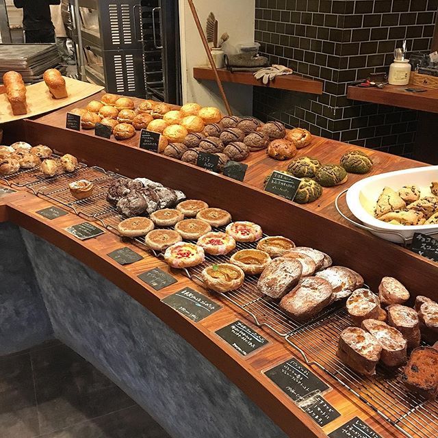 an assortment of baked goods on display at a bakery