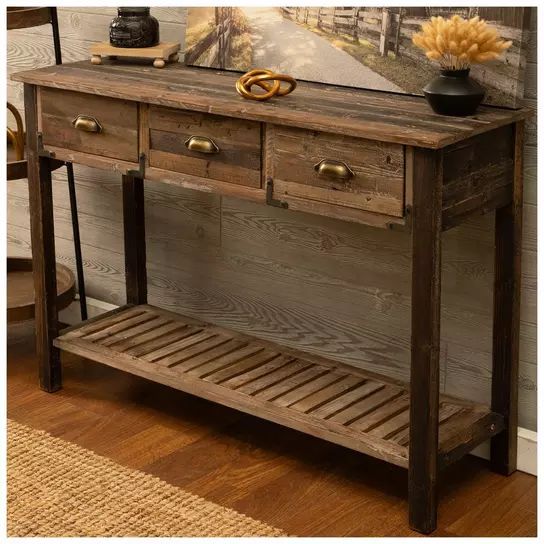 a wooden table with two drawers and a shelf underneath it on a hard wood floor